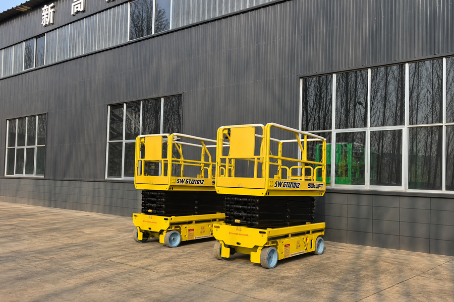 Two Yellow 35 ft Scissor Lifts